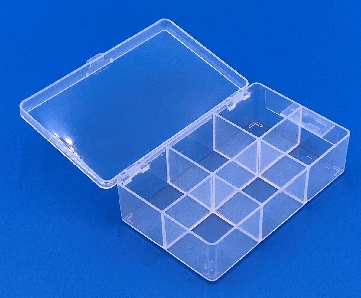 D23 case, 6 bays with a hang tab, molded in clear polypropylene, open