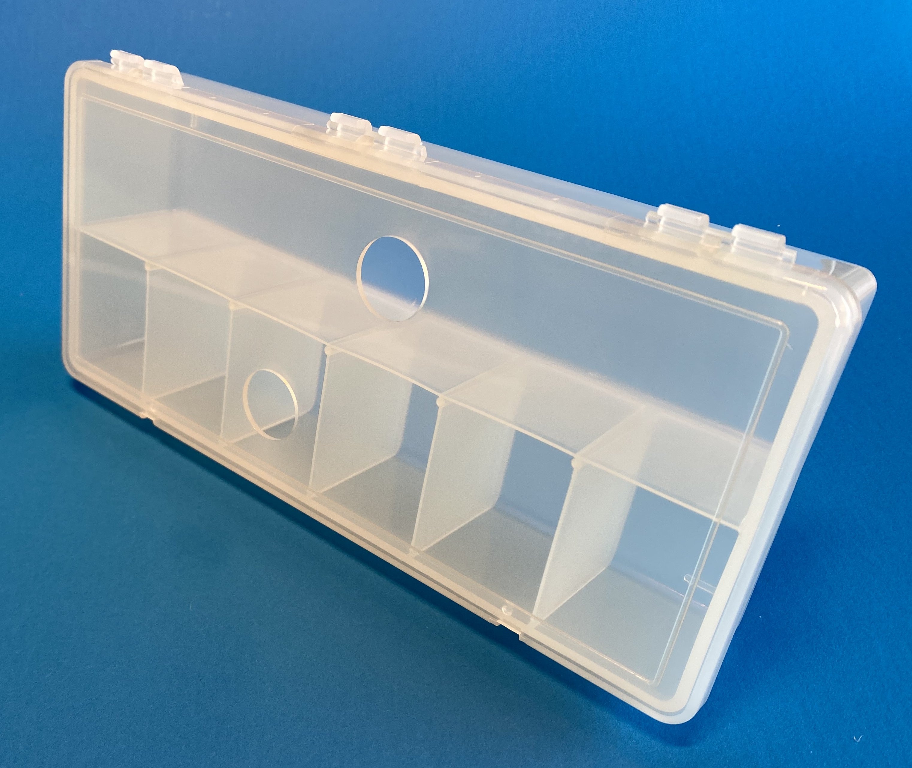 D54 case, 7 bays, with two finger holes in lid, molded in clear polypropylene, closed view 2
