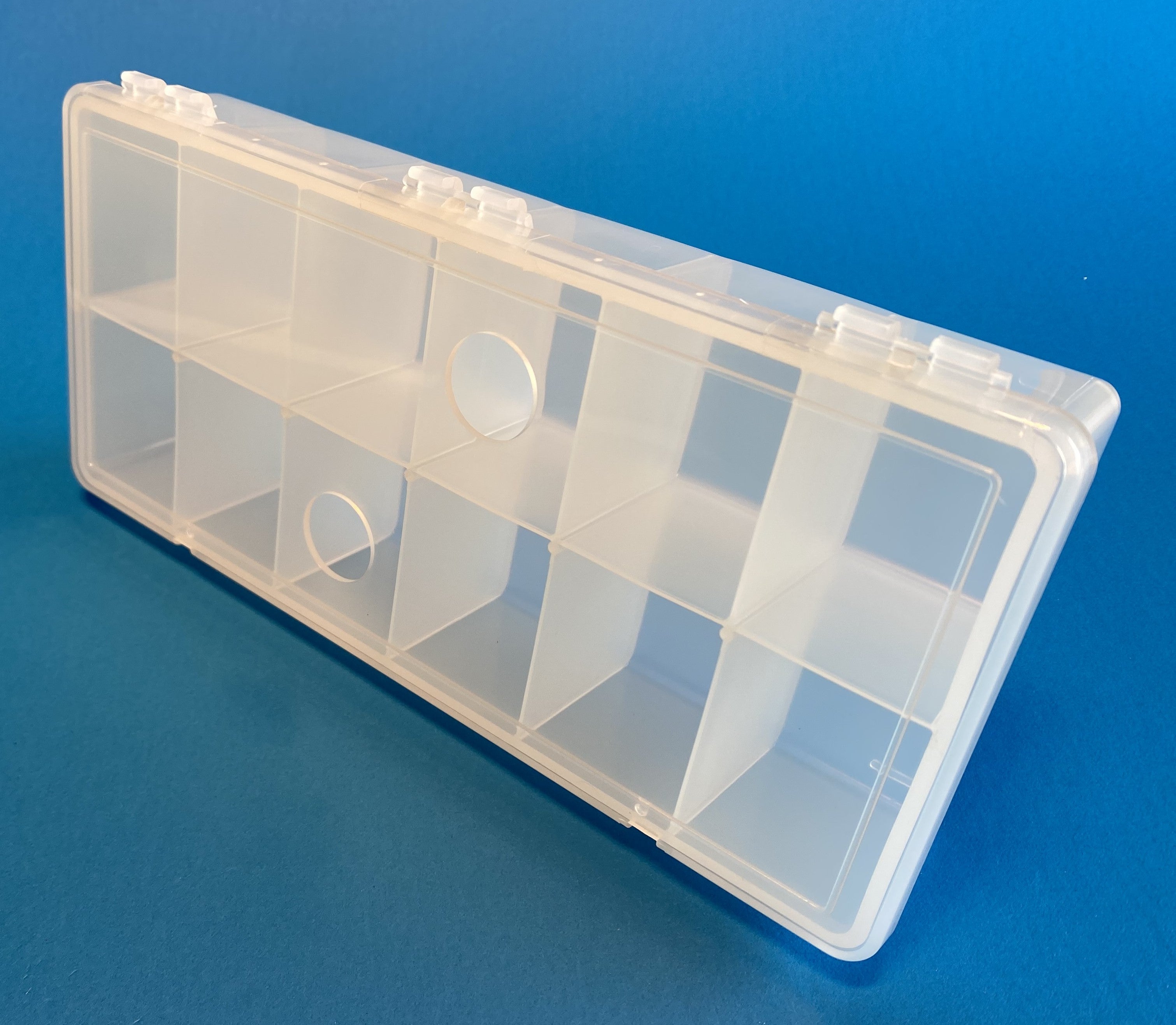 D54 case, 12 bays, with two finger holes in lid, molded in clear polypropylene, closed view 2
