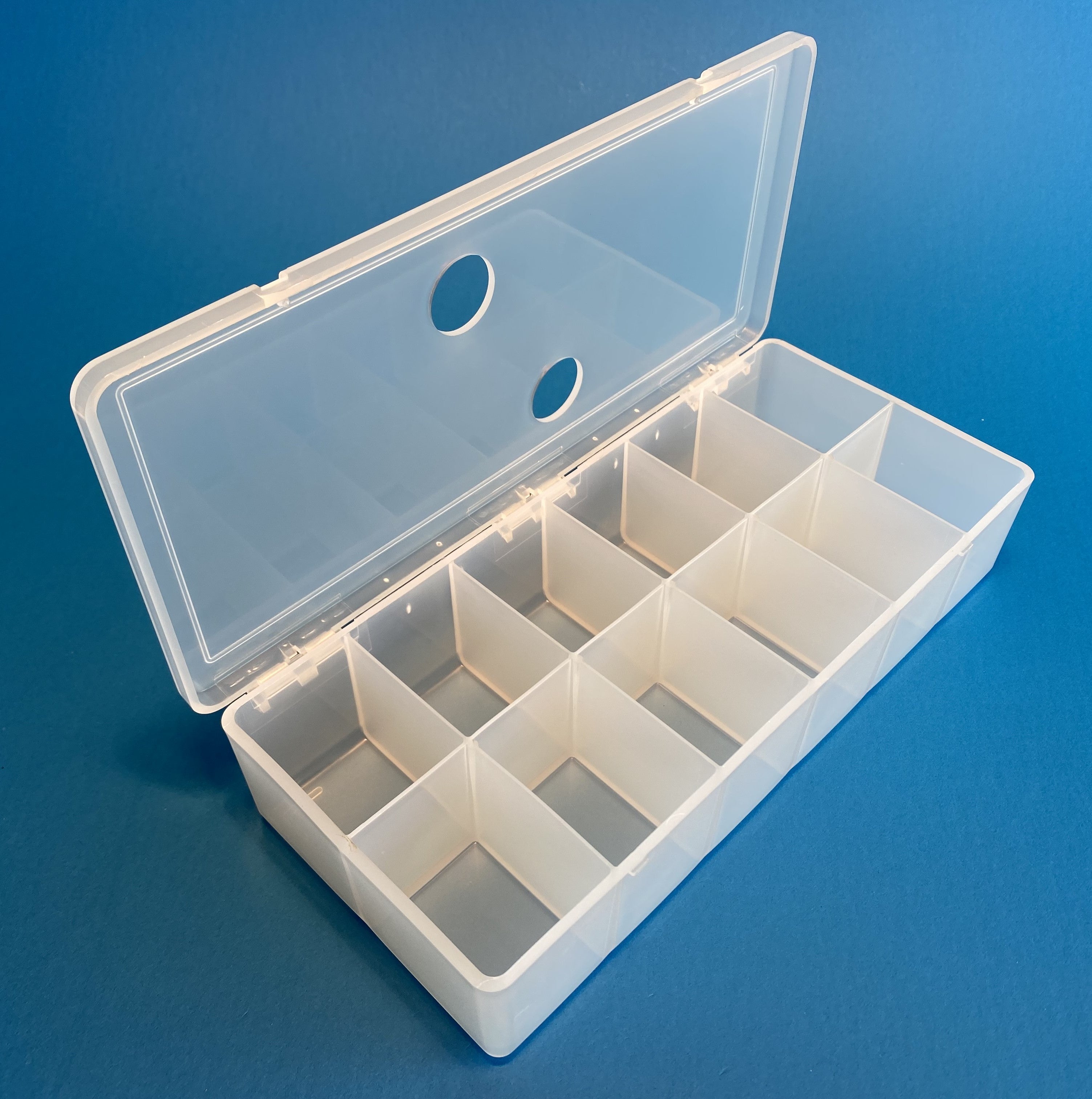 D54 case, 12 bays, with two finger holes in lid, molded in clear polypropylene, open