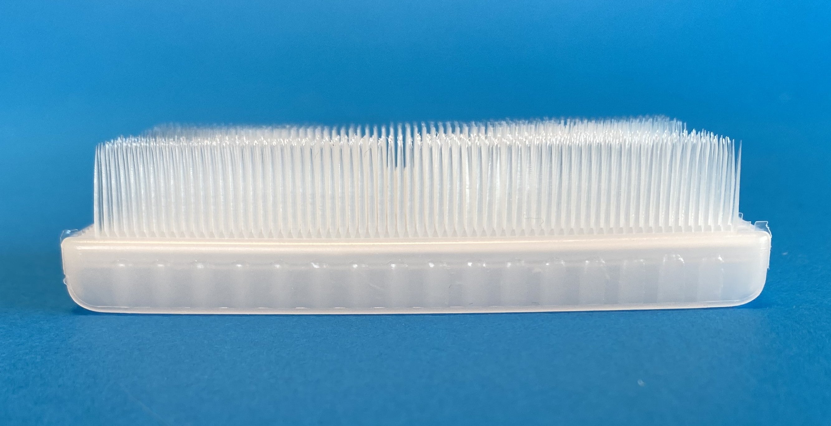 Surgical-style scrub brush for hands and nails, side view